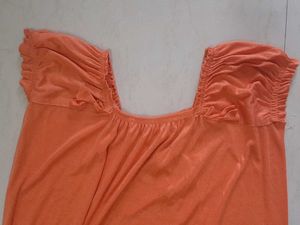 Elegant Orange Gown with Smocked Neckline