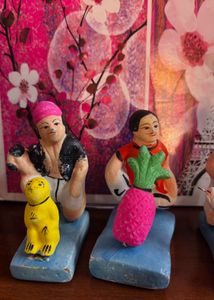 Clay dolls for jhulon decoration