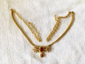 Elegant Gold Necklace with Red Stone