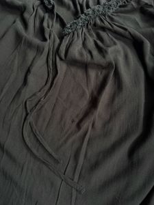 Oversized black tie front blouse