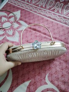 27.Sparkly Oval Clutch Bag