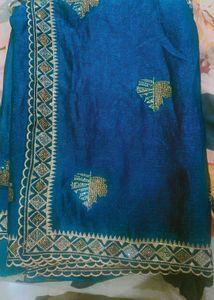 Elegant Teal Saree with Gold Embellishments