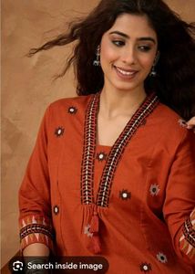Unused Rust short embroidered Kurti.