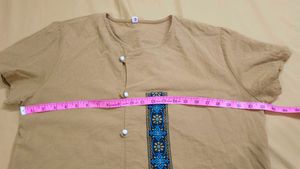 mustard-colored, short-sleeved top