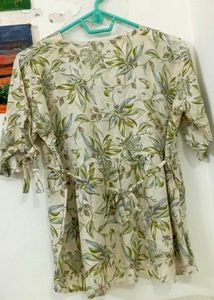 Soft beige color with floral and leaf printV-neck