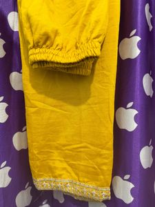 Elegant Yellow Kurti pant with Intricate Neckline