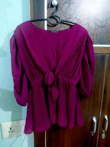 A beautiful decent purple top with florry sleeves