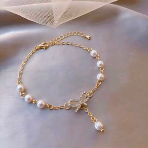 Elegant Pearl & Bow Bracelet