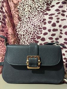 Chic Black Crossbody Bag with Gold Buckle