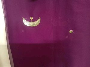 Elegant Purple Saree with Gold Embellishments