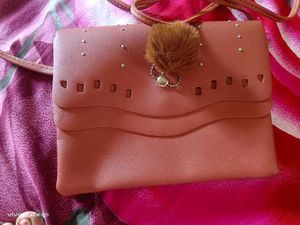 Stylish Pink Clutch with Pom-Pom