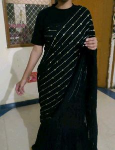 Elegant Black Saree with Golden Embellishments
