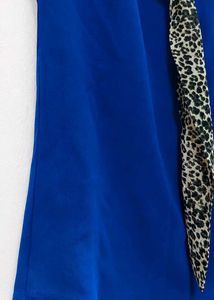 Stylish Blue Sleeveless Top with Scarf Detail