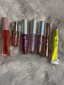 Assorted Lip Glosses and Makeup Bag