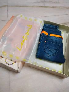 Stylish Blue Denim Capris with Orange Accents