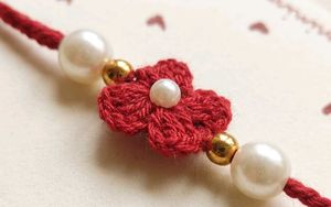 Elegant Red Blossom Crochet Rakhii
