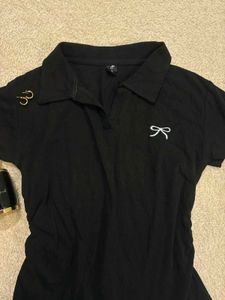 Chic Black Polo Shirt with Bow Detail