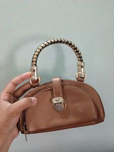 Stylish Brown Clutch with Unique Handle