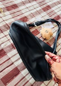 Stylish Black Hobo Bag with Charm