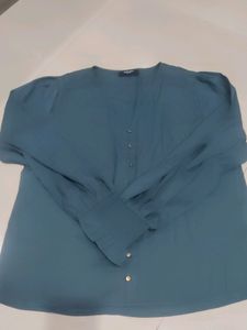 It's a Primo Knot Brand Shirt Style Top