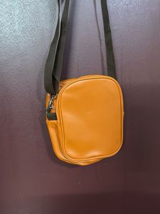 Orange "carry-on cool" crossbody bag