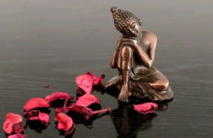 Resting Buddha on Knee Metal Showpiece