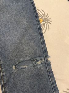 Distressed Blue Denim Jeans