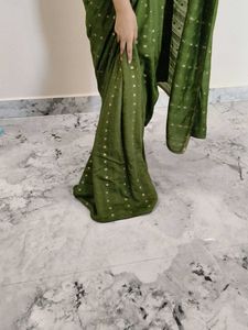 Elegant Green Saree with Gold Accents