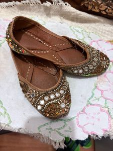 Embellished golden traditional Juttis