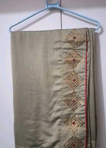 Elegant Beige Saree with Gold Embellishments