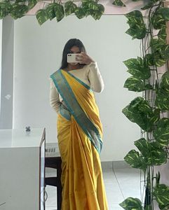 Elegant Yellow Saree with Teal Border