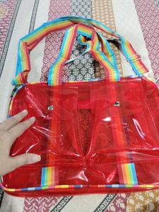 Red Jelly Duffle Bag with Rainbow Strap