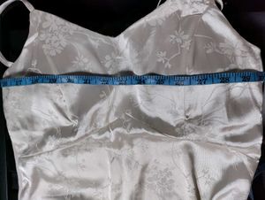 Off-white satin strappy top.