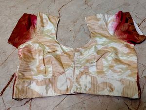 pink border with a cream colour blouse