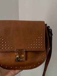 Faux leather saddle bag with stud