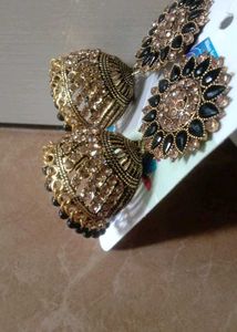 Gold Jhumka Earrings with Black Stones