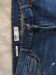 Ripped High-Waisted Blue Jeans