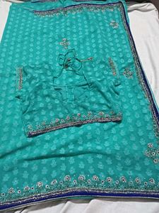 Stunning Teal Saree with Embellished Blouse