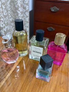 13 Assorted Perfume Bottles