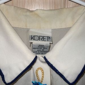 Elegant Cream Blouse with Blue Embroidery
