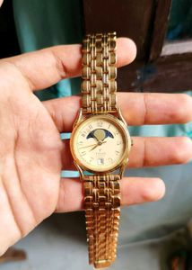 Elegant Gold Titan Watch with Moon Phase