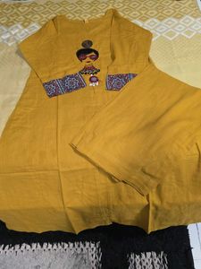 Stylish Mustard Kurta Set with Embellished Necklin