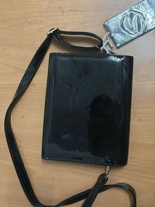 Shiny Black Clutch with Apple Embellishment