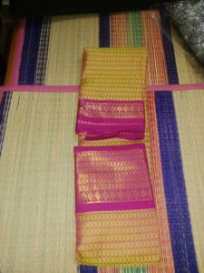 a pink and gold yellow colour silk saree