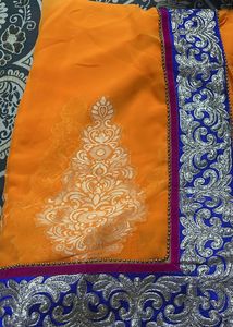 Vibrant Orange Saree with Silver Embroidery