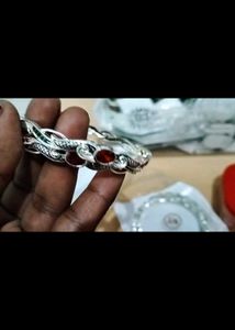 Elegant Silver Bangle with Red Stones