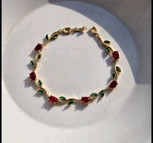 Elegant Gold Bracelet with Red & Green Stones