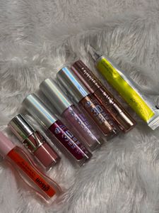 Assorted Lip Glosses and Makeup Bag