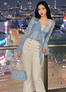Chic White Bell Bottom Pants with Gold Buttons