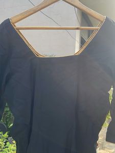 Elegant Black Blouse with Gold Trim